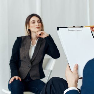 Business man communicates with a woman in a suit, staff vacancies resume